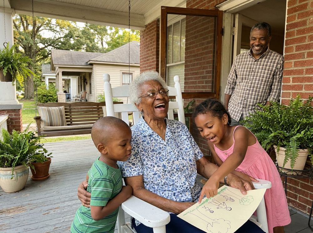 A grandmother on the porch with her grandkids